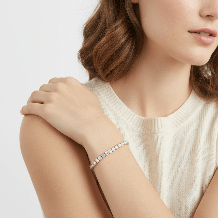 Woman wearing a Gold Crystal Tennis Classic Bracelet  on a plain background