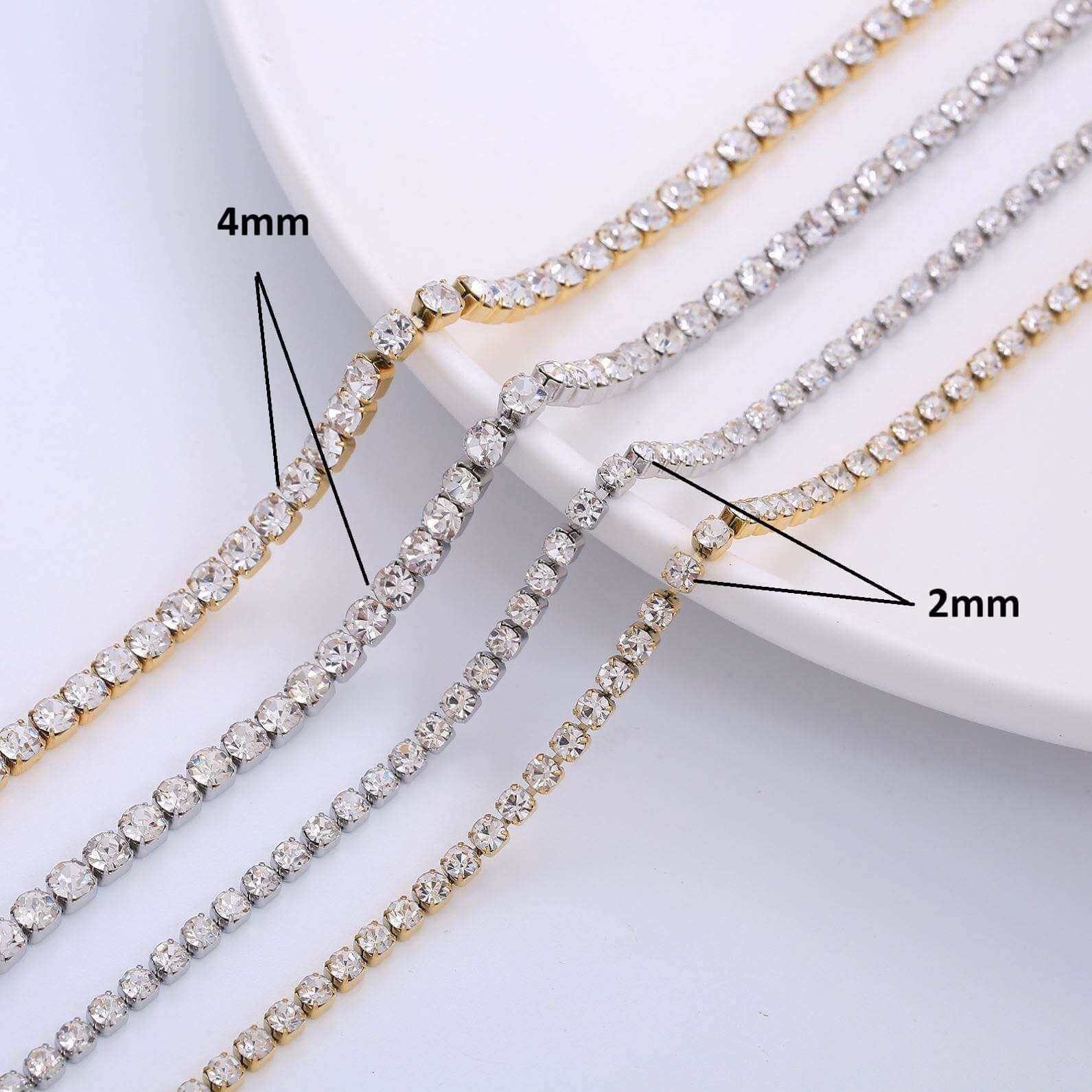 Gold Crystal Tennis Classic Bracelet displayed with 4mm and 2mm stone details on a white plate.