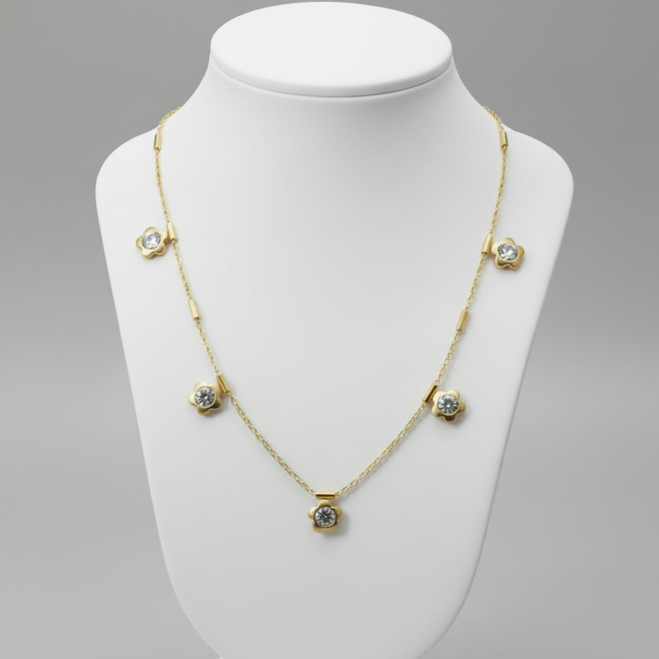 Gold Dainty Floral Crystal Necklace on plain background