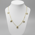 Gold Dainty Floral Crystal Necklace on plain background