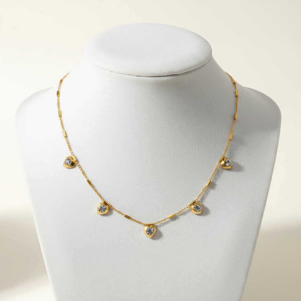 Gold Dainty Heart Crystal Station Necklace on a light background