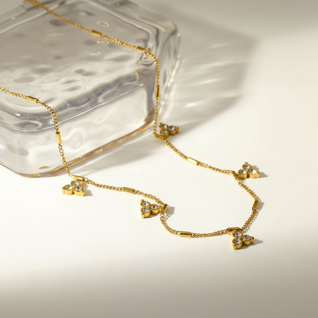 Gold Dainty Triangle Crystal Station Necklace with plain background