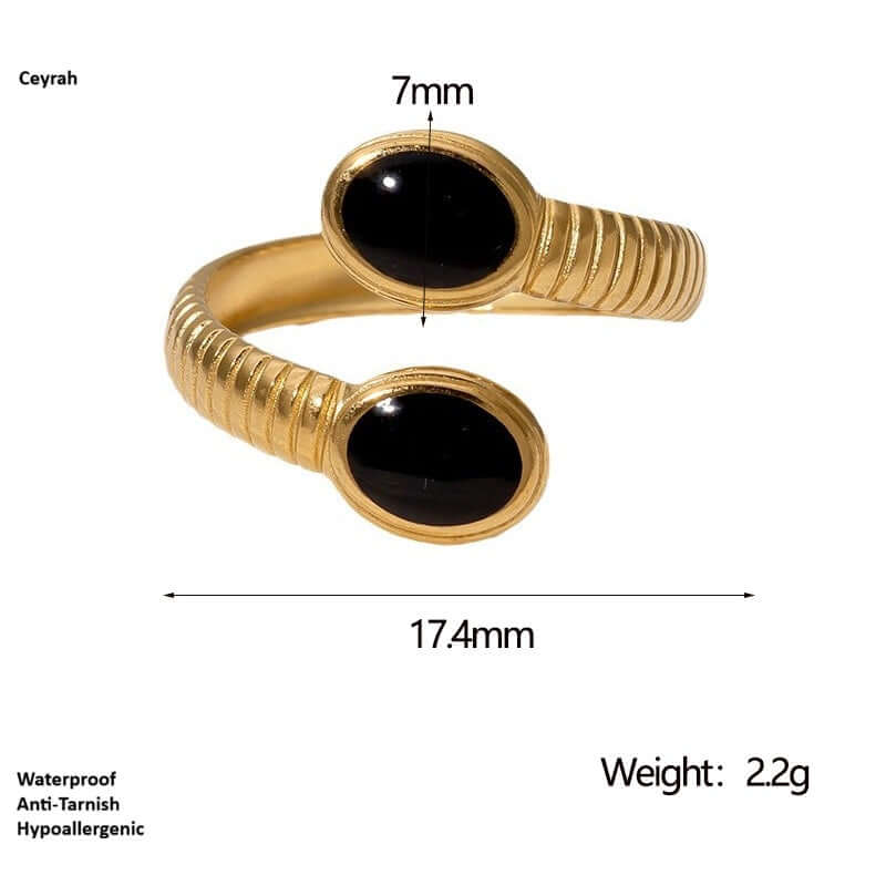 Gold bracelet with black stones and measurements on a white background