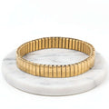 Gold Elastic Stainless Steel Bracelet on a white background