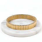Gold Elastic Stainless Steel Bracelet on a white background