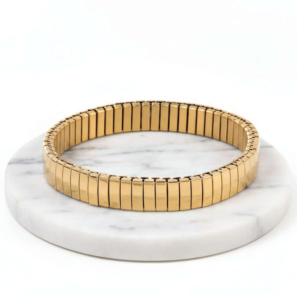 Gold Elastic Stainless Steel Bracelet on a white background