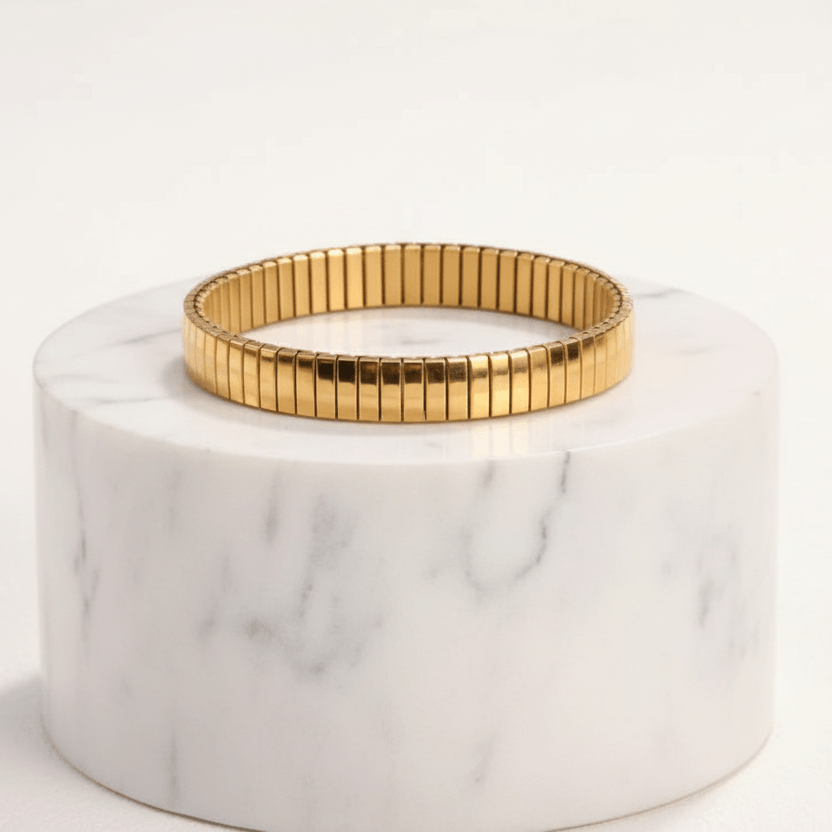 Gold Elastic Stainless Steel Bracelet with a gold rim on a white background