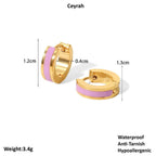 Gold Enamel Huggie Hoop Earrings with pink accents and measurements on a white background