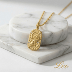 Leo Gold Engraved Zodiac Sign Necklace on a marble surface