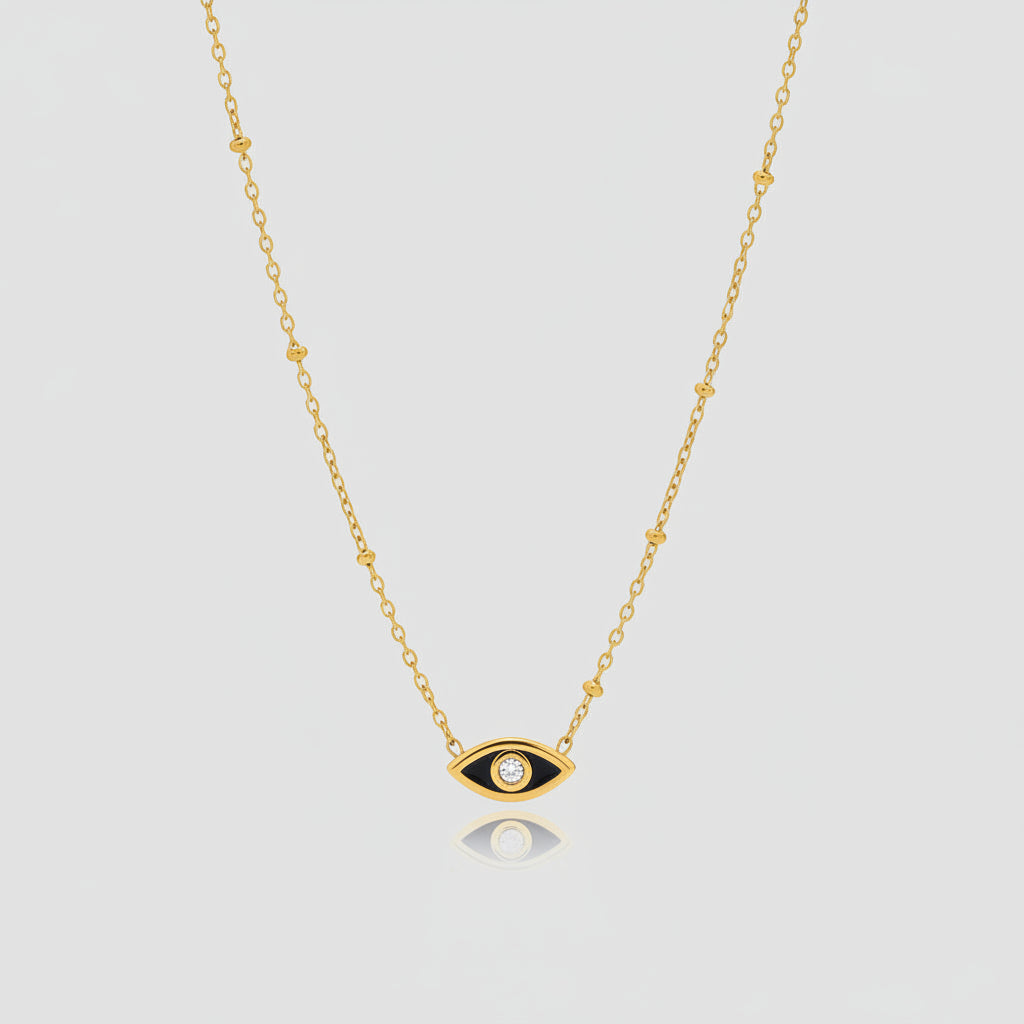 Gold Evil Eye Mini Charm Necklace on plain background
