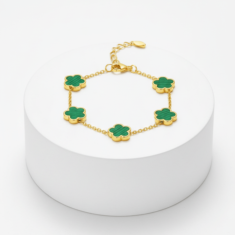 Gold Five Clover Bracelet on green on pedestal