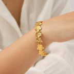 Gold Floral Cuff Bracelet on model hand