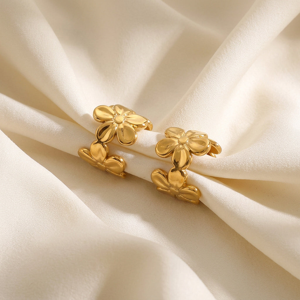 Gold Floral Ear Cuff Set on a textured surface