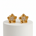 Gold Floral Shaped Stud Earrings on a white pedestal against a white background