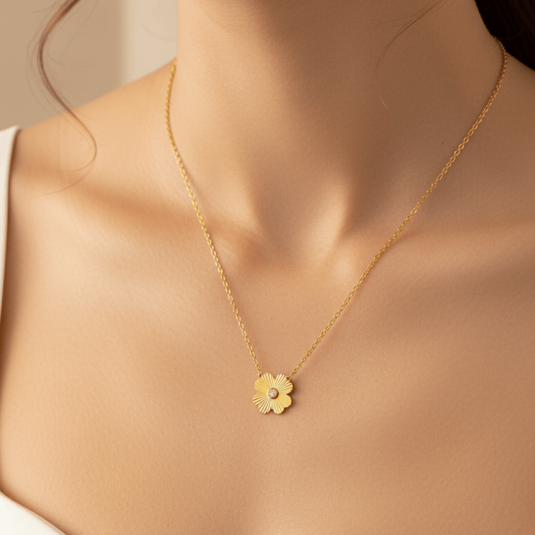 Gold Flower Pendant Necklace with a flower pendant worn by a model