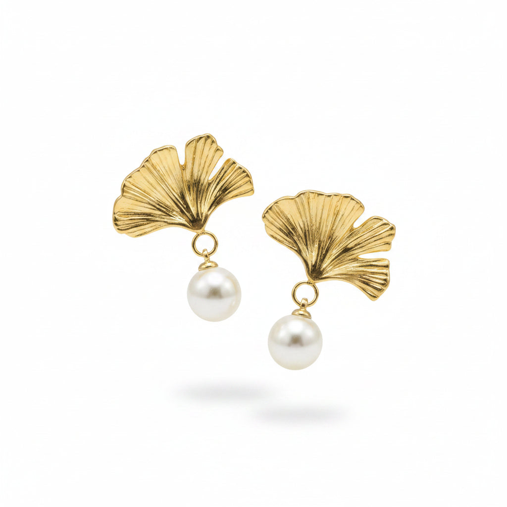 Gold Ginkgo Leaf Pearl Drop Earrings plain background 