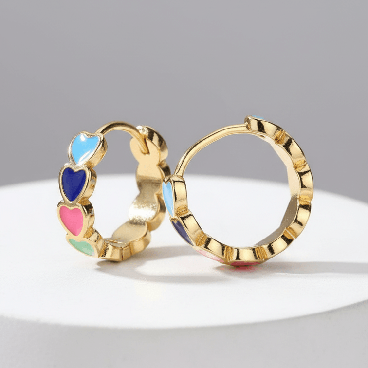 Gold Heart Charm Hoop Earrings with colorful heart-shaped stones on a gray background
