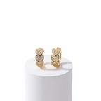Gold Heart Crystal Cluster Hoop Earrings on a white pedestal with a white background