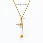 Gold Heart Drop Y Necklace Adjustable with two dangling heart charms, shown on a white background with measurement annotations indicating a total length of 48.5cm plus individual charm and connector measurements.