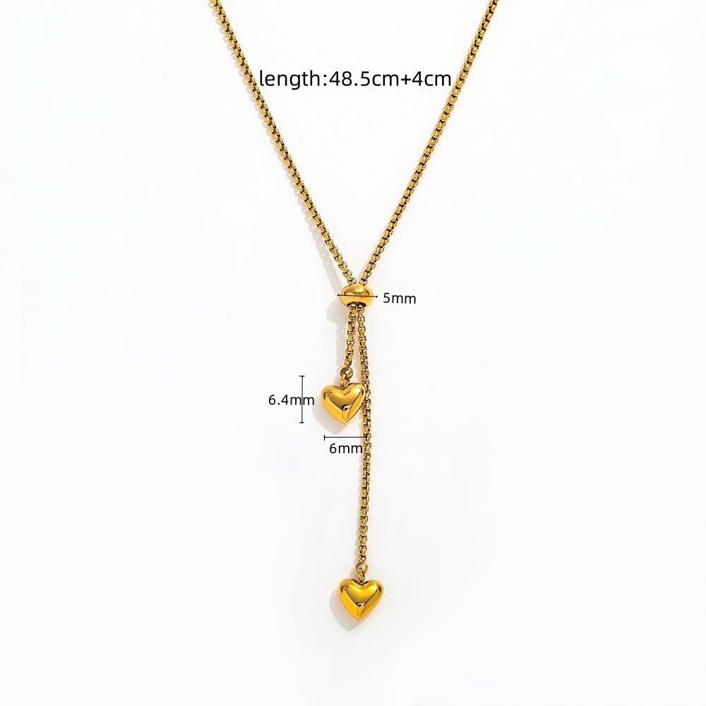 Gold Heart Drop Y Necklace Adjustable with two dangling heart charms, shown on a white background with measurement annotations indicating a total length of 48.5cm plus individual charm and connector measurements.