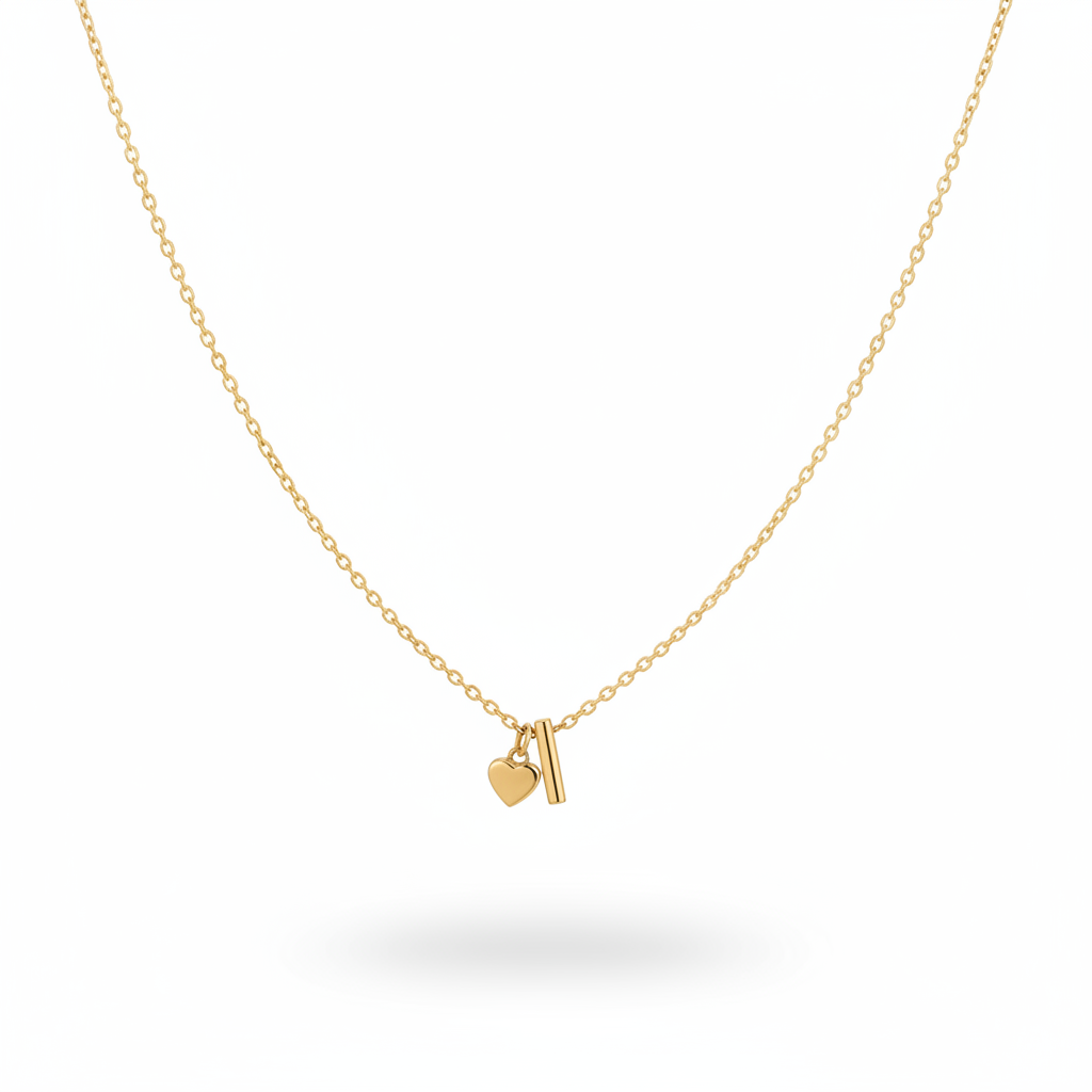 A delicate Gold Heart & I Initial Pendant Necklace, displayed against a clean white background with a soft shadow underneath.