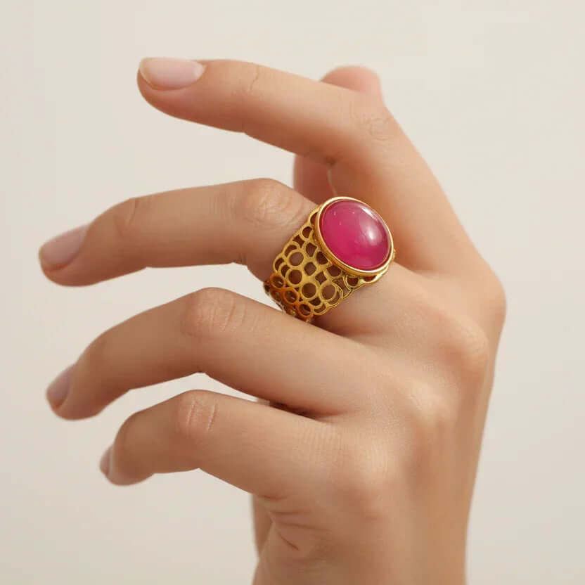 Hand wearing a Gold Honeycomb with Gemstone Ring with red stone, Ceyrah jewellery