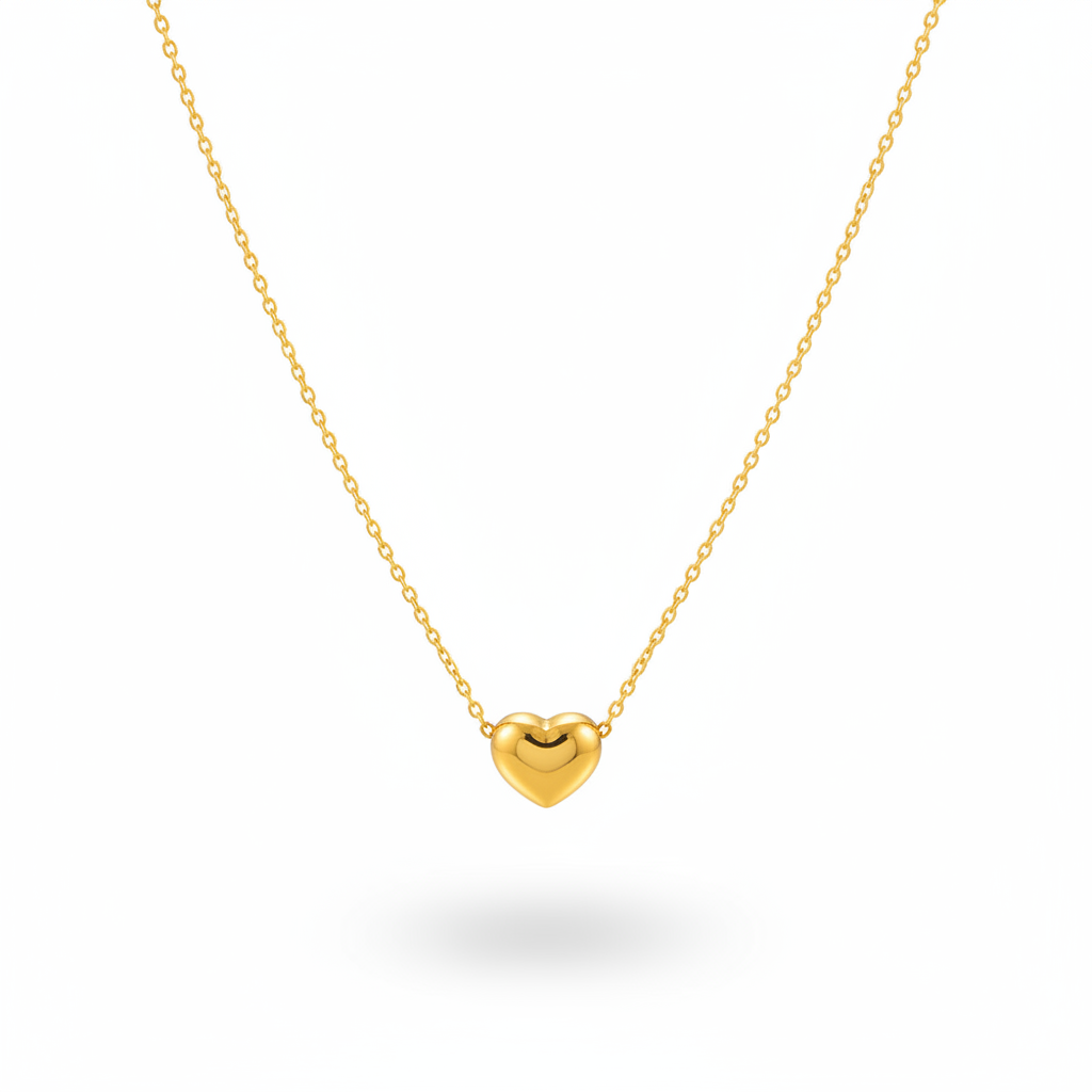 Gold Mini Heart Necklace shown against a solid white background with a soft shadow beneath.