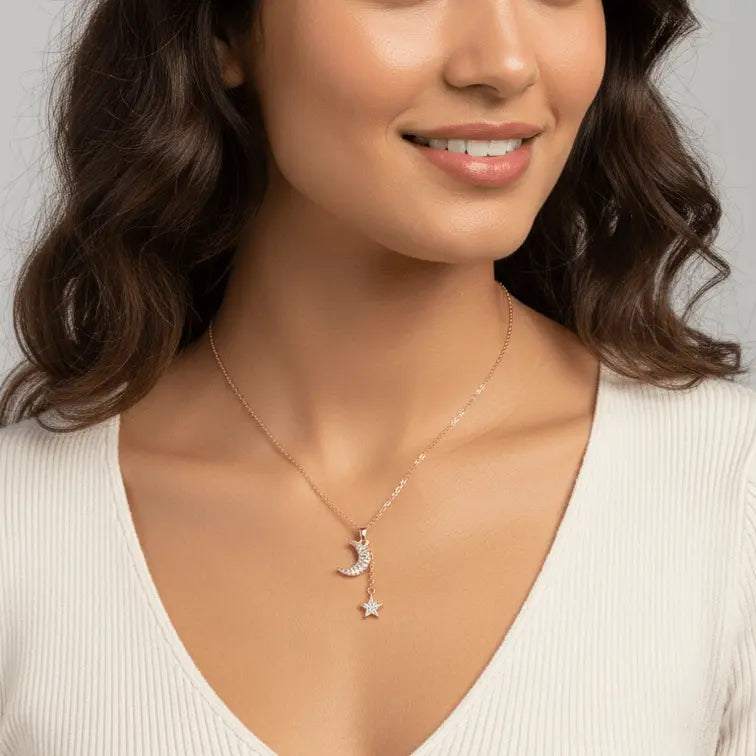 Woman wearing a Gold Moon & Star Celestial Necklace with a moon pendant against a neutral background