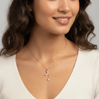 Woman wearing a Gold Moon & Star Celestial Necklace with a moon pendant against a neutral background