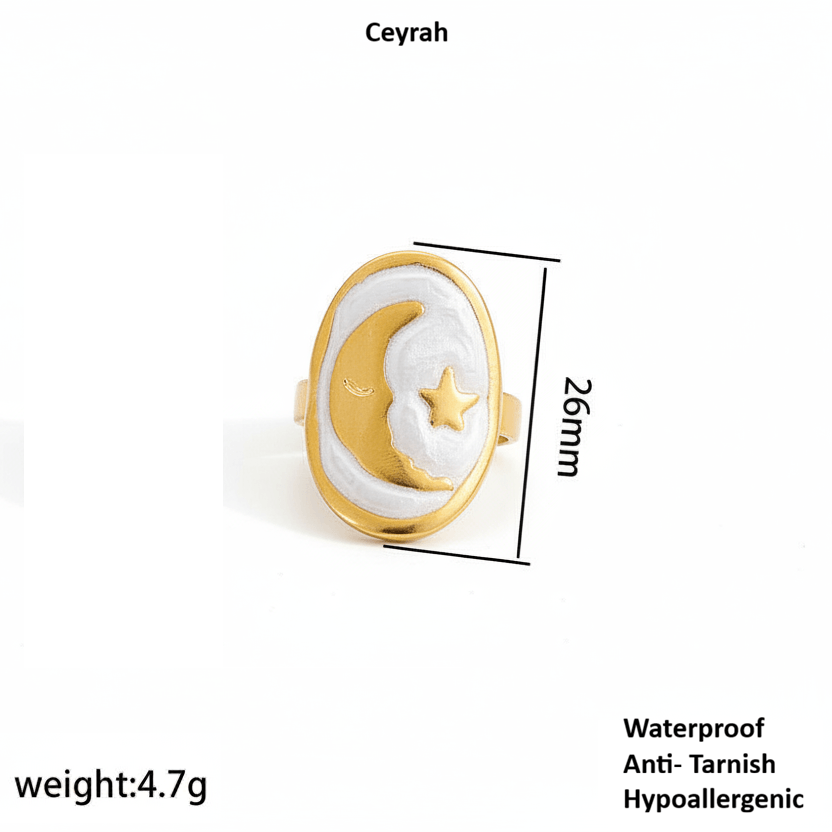 Gold Moon and Star Oval Ring with white center, gold crescent moon and star, vintage-inspired design.