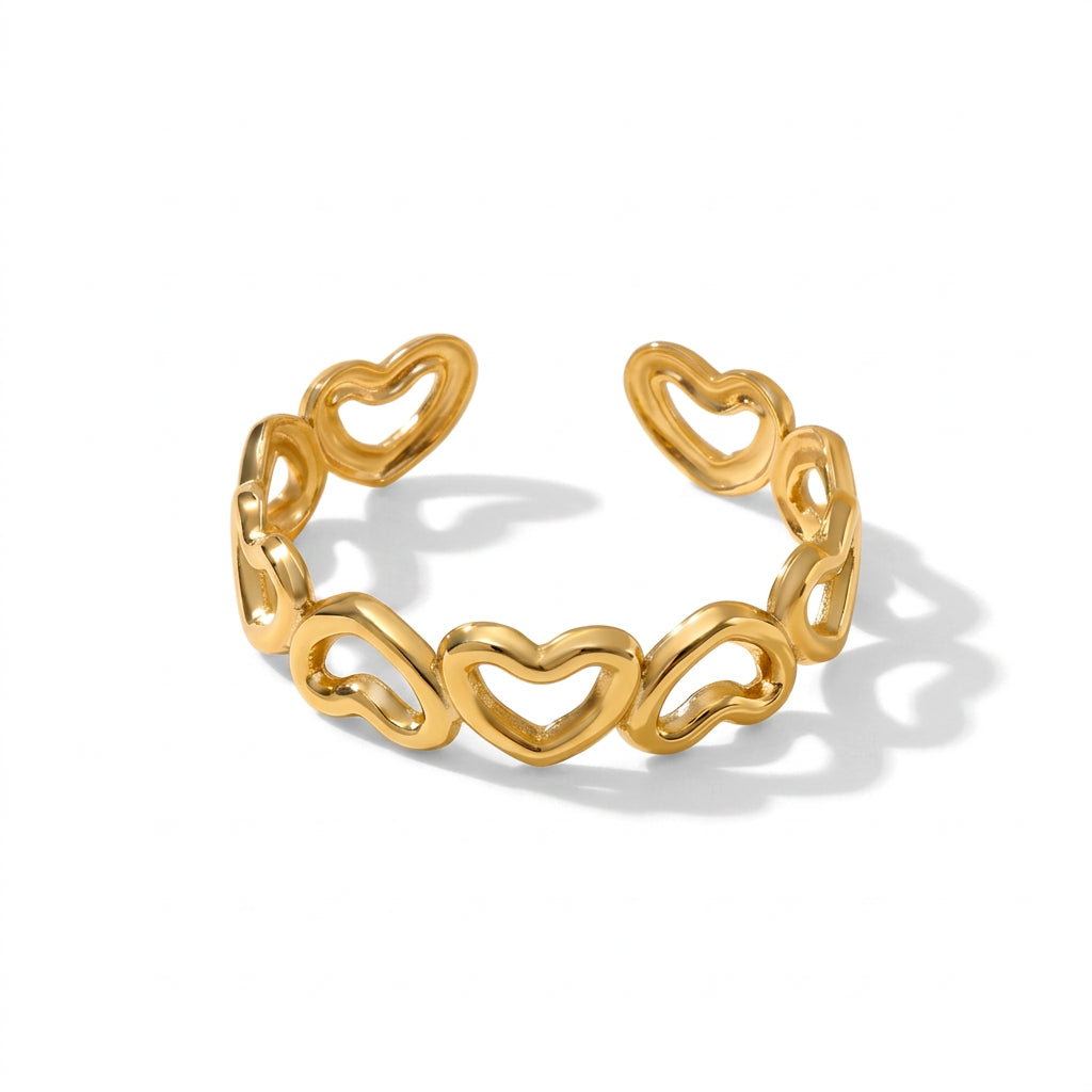 Gold Open Heart Adjustable Ring featuring a continuous link design of interlocking hearts, shown on a clean white background with a soft shadow.