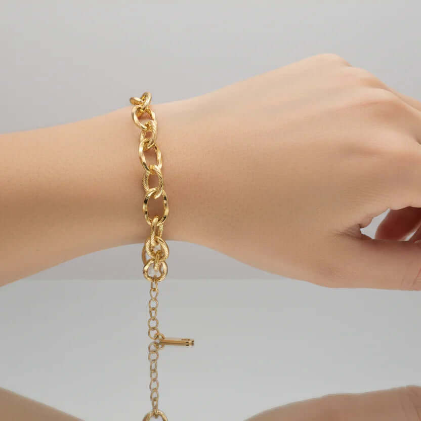 Ceyrah Gold Oval Link Chain Bracelet on wrist, jewellery against neutral background