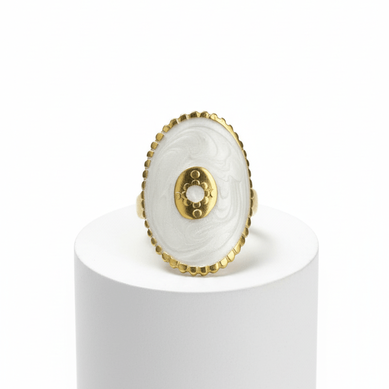 Gold Oval Statement Ring  on a white pedestal against a white background
