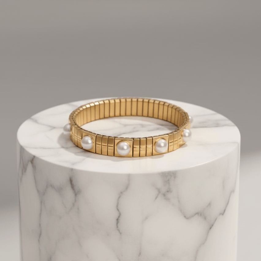 Gold Pearl Accent Bracelet on a marble surface