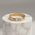 Gold Pearl Accent Bracelet on a marble surface