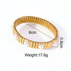Gold Pearl Accent Bracelet on a textured white background, showing measurements and weight.
