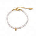 Gold Pearl Bead Bracelet with plain background