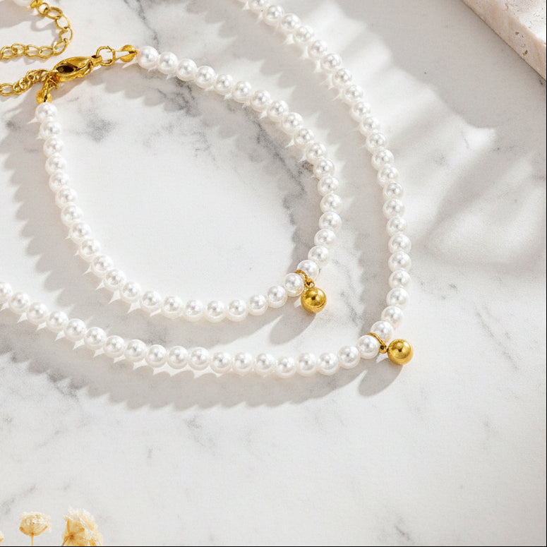 Gold Pearl Bead Necklace on display