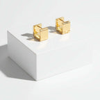 Gold Rectangular Huggie Hoop Earrings on a white background