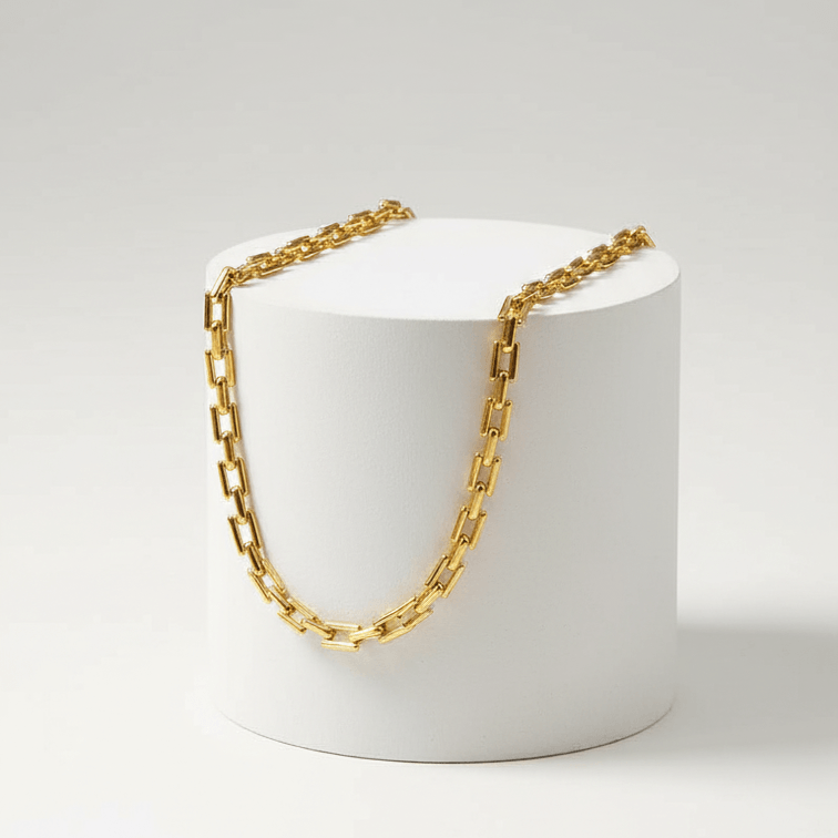 Gold Rectangular Link Chain Necklace on pedestal