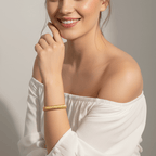 Gold Ribbed Coil Bangle Bracelet on model 