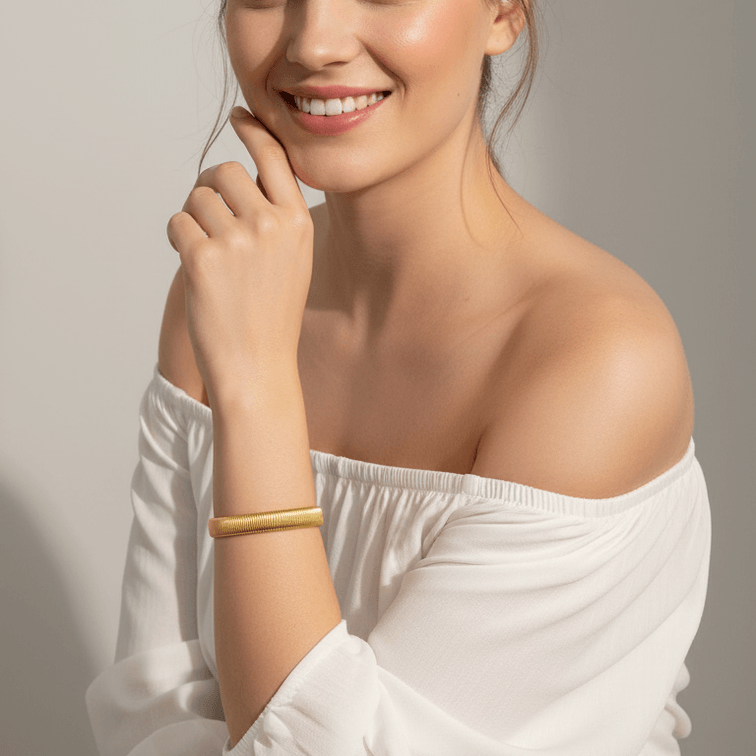 Gold Ribbed Coil Bangle Bracelet on model 