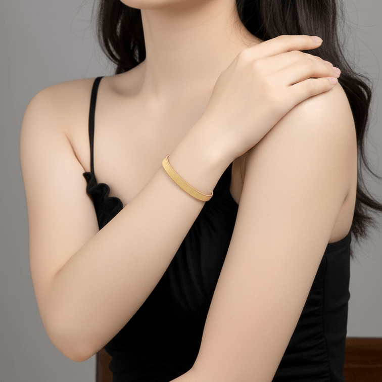 Gold Ribbed Coil Bangle Bracelet on model