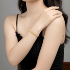 Gold Ribbed Coil Bangle Bracelet on model