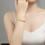 Gold Ribbed Coil Bangle Bracelet on model