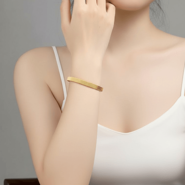 Gold Ribbed Coil Bangle Bracelet on model