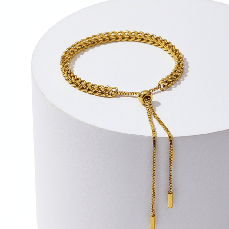 Gold Rope Chain Adjustable Bracelet on a white cylindrical stand with a white background