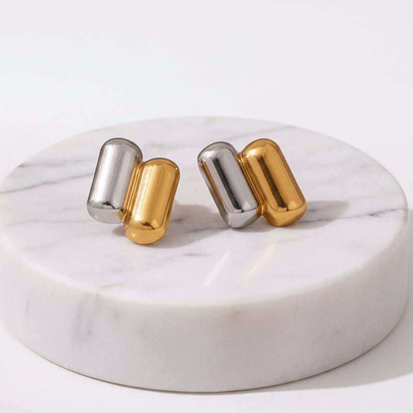 A pair of Gold & Silver Capsule Stud Earrings displayed on a clean white background with dimension 
