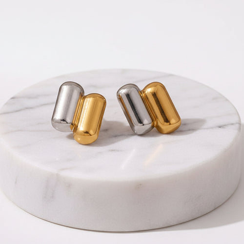 A pair of Gold & Silver Capsule Stud Earrings displayed on a clean white background with dimension 