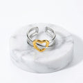 Gold & Silver Heart Adjustable Ring with a textured gold heart-shaped accent in the center, shown with printed dimensions and weight on a white background.